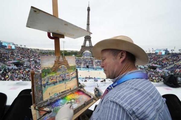 Peter&#x20;Spens,&#x20;of&#x20;London,&#x20;England,&#x20;paints&#x20;the&#x20;scene&#x20;at&#x20;Eiffel&#x20;Tower&#x20;Stadium&#x20;during&#x20;a&#x20;beach&#x20;volleyball&#x20;match&#x20;at&#x20;the&#x20;2024&#x20;Summer&#x20;Olympics,&#x20;Saturday,&#x20;July&#x20;27,&#x20;2024,&#x20;in&#x20;Paris,&#x20;France.&#x20;&#x28;AP&#x20;Photo&#x2F;Robert&#x20;F.&#x20;Bukaty&#x29;